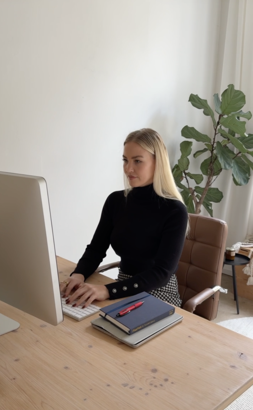 Laura working on creative strategy at her desk